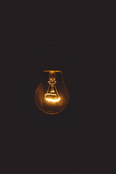 A light bulb in a dark background