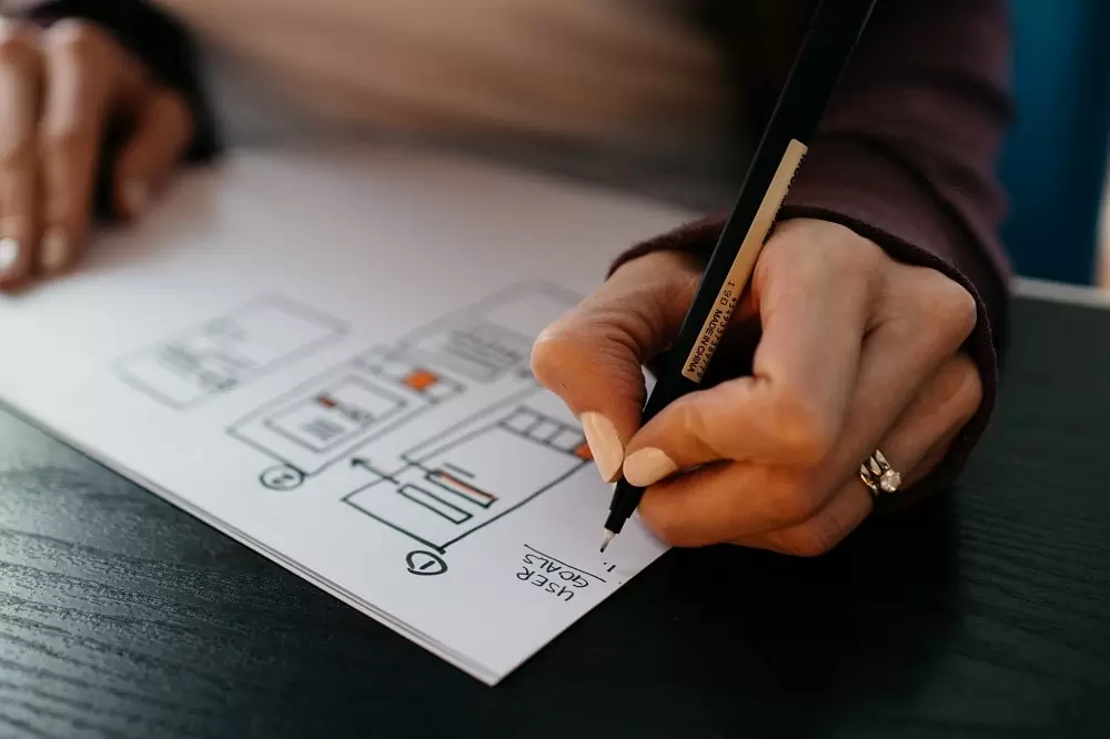 Designer sketching layout ideas