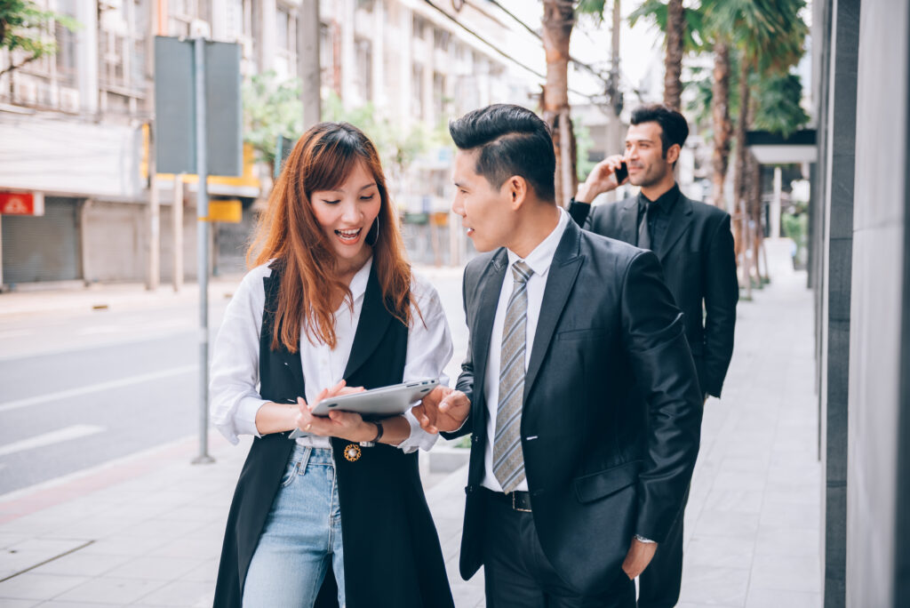 Business people talking outdoors in a business district